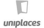 Logo da Uniplaces, que mostra o nome da empresa em uma fonte estilizada em azul, com um ícone representando um local. Este design simples e moderno destaca o foco da Uniplaces em acomodação e moradia.