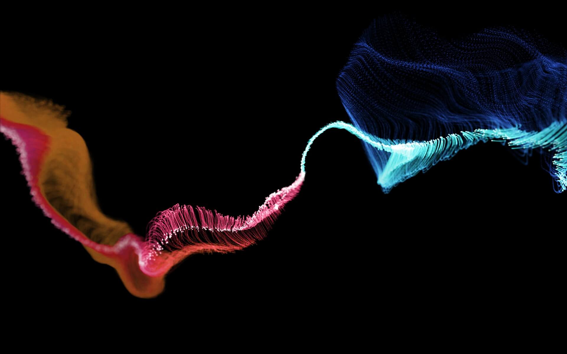 Abstract 3D particle waves transitioning from orange to pink and cyan flowing smoothly across a black background, evoking a dynamic data stream or digital network movement