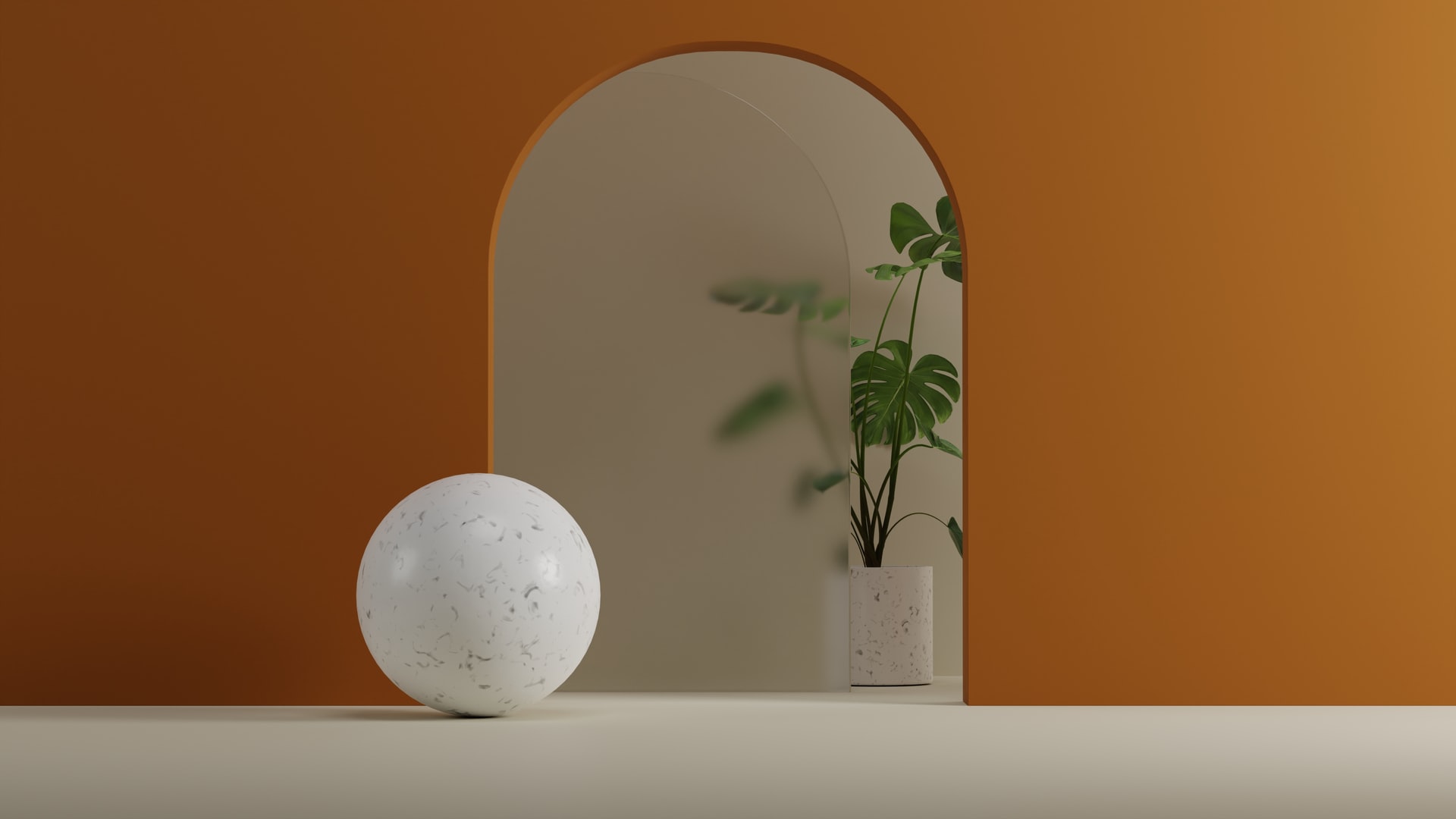 Minimalist scene with a white terrazzo textured sphere on a cream floor in front of an orange arched wall framing a beige niche that holds a terrazzo planter with a tall leafy Monstera plant